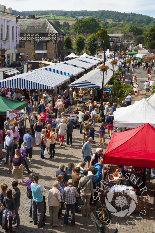 Busy Castle Square filled with visitors and stalls during the Ludlow Food Festival, Shropshire, England.