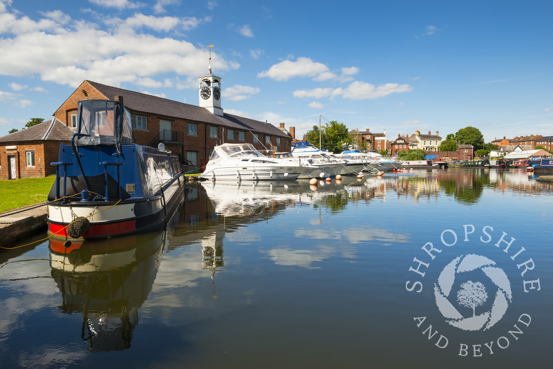 A line of boats moored in front of Stourport Yacht Club at Stourport-on-Severn, Worcestershire, England.