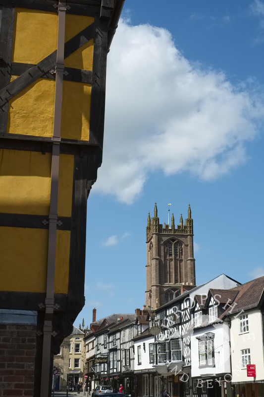 St Laurence's Church and a half-timbered building in Broad Street, Ludlow, Shropshire.