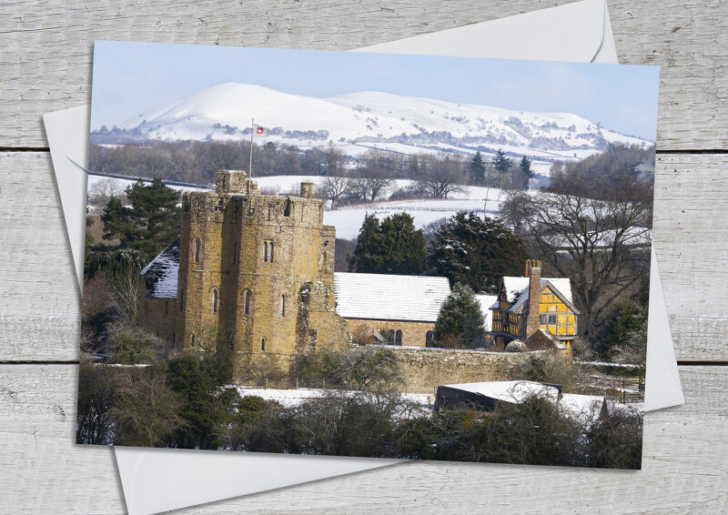 Winter snow at Stokesay Castle and Ragleth Hill, Shropshire.