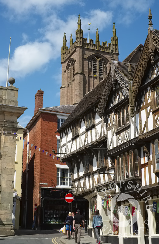 St Laurence's Church overlooks half-timbered buildings in Broad Street, Ludlow, Shropshire.