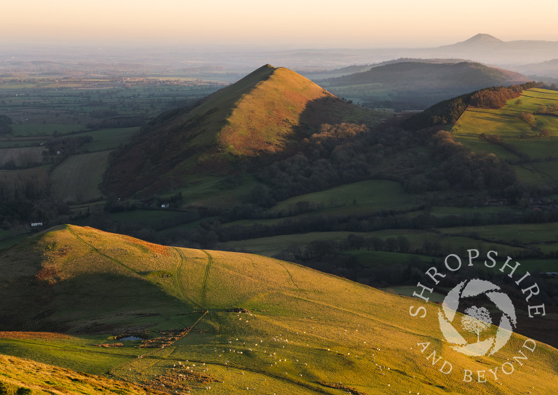 Winter sunrise on Caer Caradoc, near Church Stretton, with the Lawley and the Wrekin.