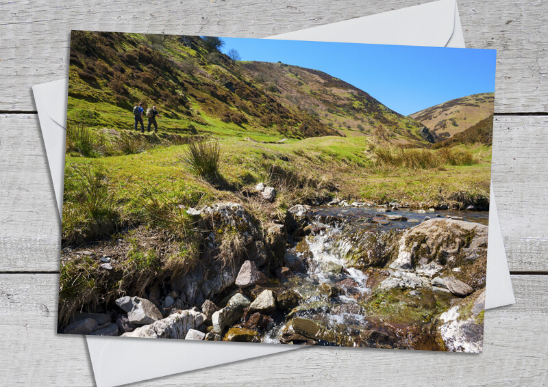Walkers in Carding Mill Valley, Shropshire.