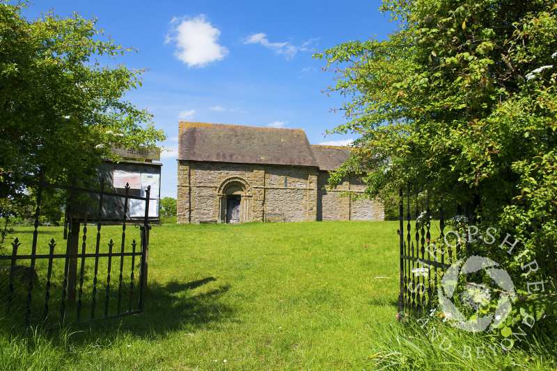 Blue skies over 12th century Heath Chapel, near Bouldon, South Shropshire, England.