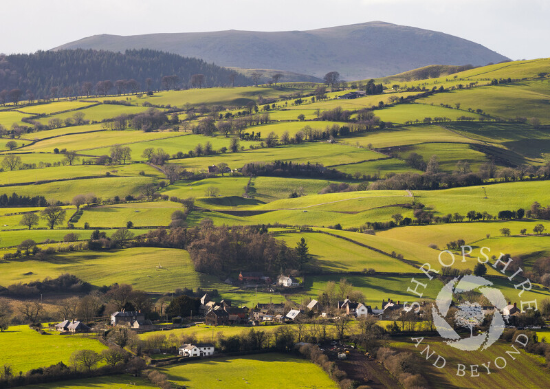 The village of Wentnor in Shropshire, with Corndon Hill, Powys, in the background.