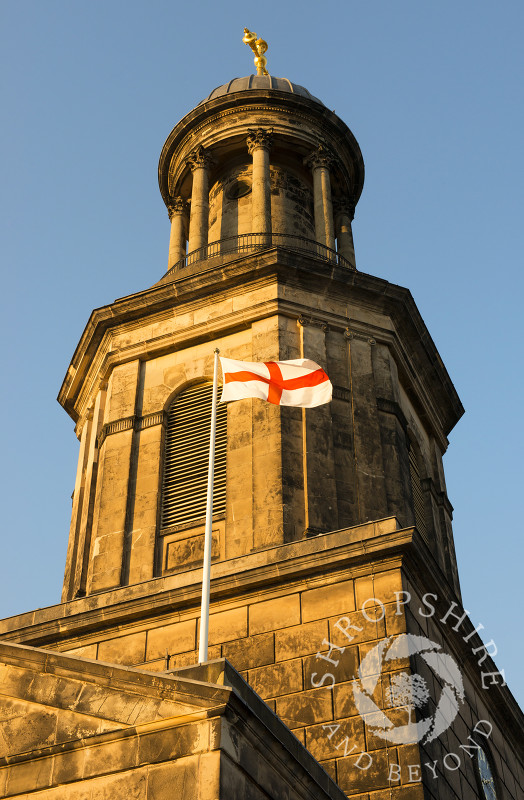 Evening light on St Chad's Church and St George's flag, Shrewsbury, Shropshire.