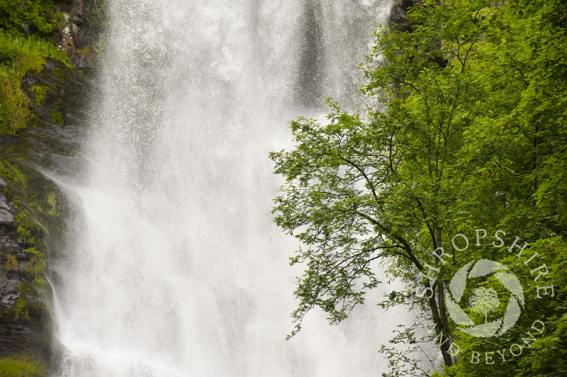 Water tumbles down Pistyll Rhaeadr waterfall in the Berwyn Mountains, Powys, Wales.