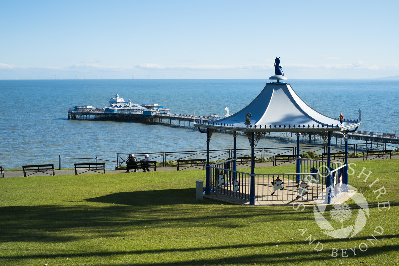 Happy Valley Gardens bandstand and Llandudno Pier, North Wales.