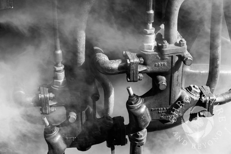 A close-up of a steam locomotive at Hampton Loade Station, Severn Valley Railway, Shropshire, England.