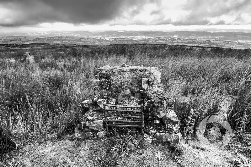 Ruined fireplace among the remains of mining on Brown Clee Hill, Shropshire, looking towards Corvedale, England.