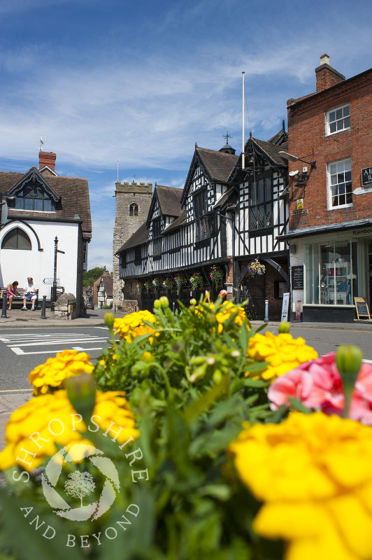 Summer flowers bloom in Much Wenlock town centre, Shropshire, England.