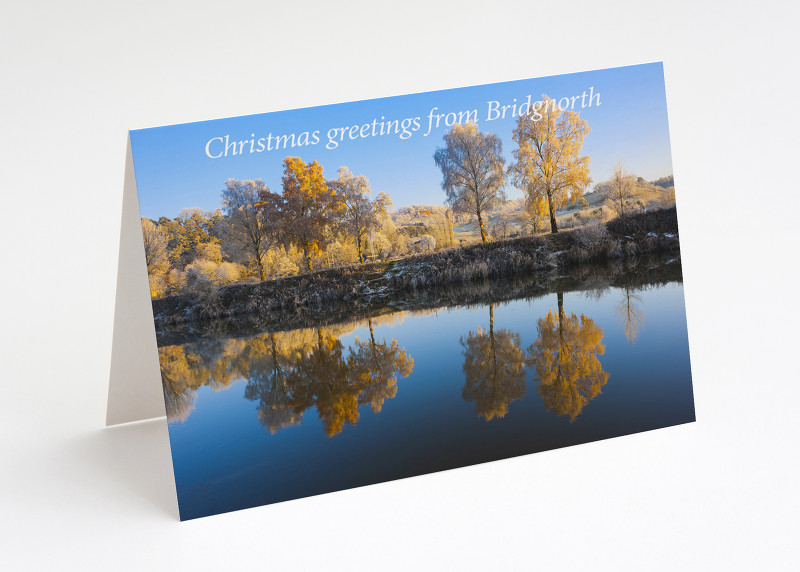 Frosty trees reflected in the River Severn at Bridgnorth, Shropshire.