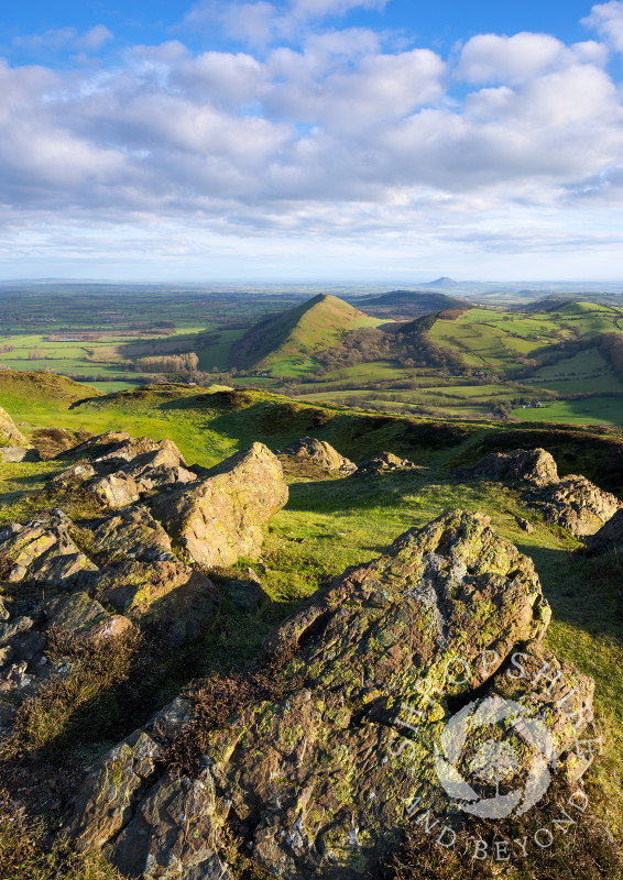 Early morning light on Caer Caradoc in the Shropshire Hills. The Lawley can be seen in the middle distance, with the Wrekin on the horizon.