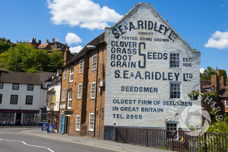 S.E. & A. Ridley Ltd advertisement on a building in Bridge Street, Bridgnorth, Shropshire, England.