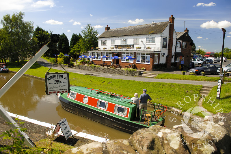 A canal boat on the Shropshire Union Canal at Norbury Junction, Staffordshire, England.