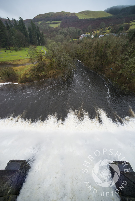 Water flowing over the dam at Lake Vyrnwy in winter, Montgomeryshire, Powys, Wales.