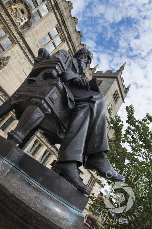Statue of Charles Darwin outside the library in Shrewsbury, Shropshire, England.