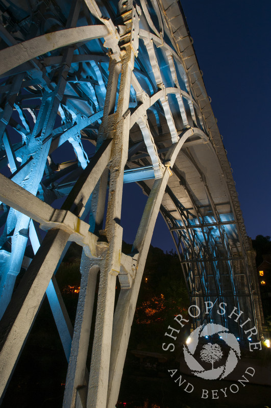 The Iron Bridge illuminated at night at Ironbridge, Shropshire, England.