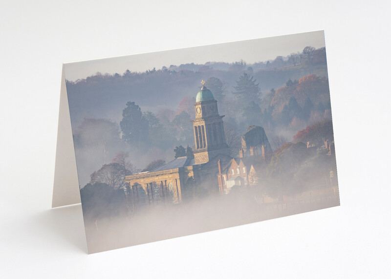 Morning mist swirls around St Mary's Church and the castle ruins at Bridgnorth, Shropshire.
