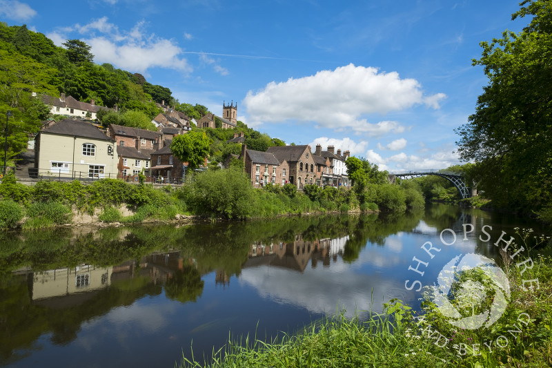 The town of Ironbridge reflected in the River Severn, Shropshire.