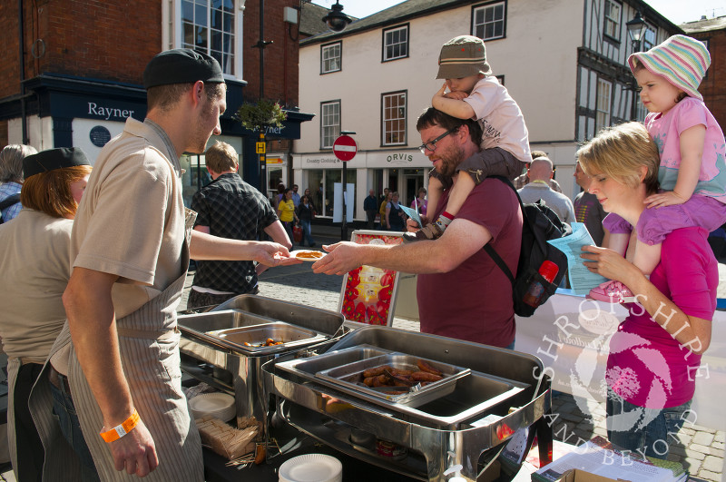 A family takes part in the Sausage Trail at Ludlow Food Festival, Shropshire, England.