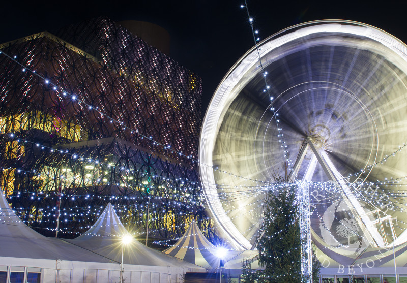 The Big Wheel and Library of Birmingham during the Frankfurt Christmas Market, Birmingham, West Midlands, England.