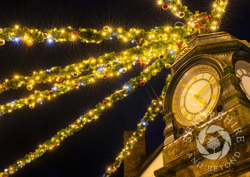 Christmas lights and the Cooke Clock in the Square at Much Wenlock, Shropshire.