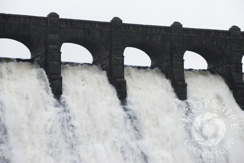 Water flowing over the dam at Lake Vyrnwy in winter, Montgomeryshire, Powys, Wales.