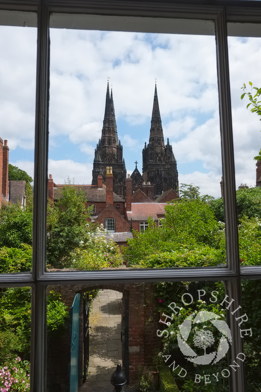 A view of Lichfield Cathedral seen through a window in Erasmus Darwin House at Lichfield, Staffordshire, England.