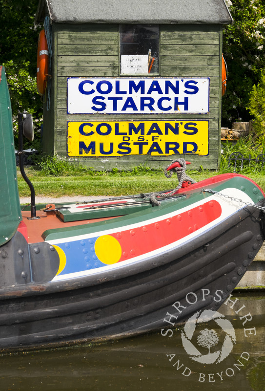 Vintage advertising signs on a hut alongside the Shropshire Union Canal at Norbury Junction,  Staffordshire.