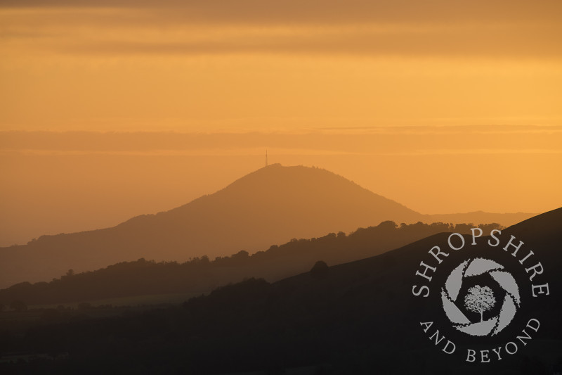 The Wrekin at sunrise seen from the Long Mynd, Shropshire.