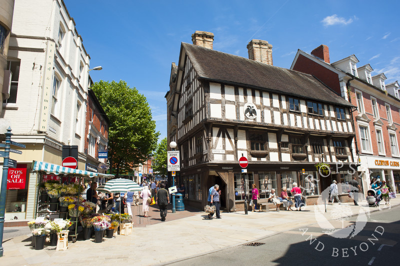 A busy street scene overlooked by Llwyd Mansion in Oswestry, Shropshire, England.