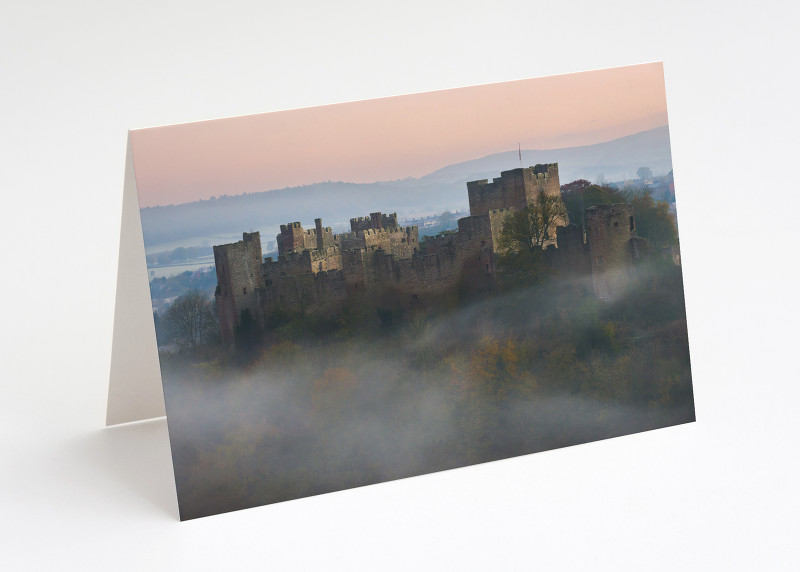 Mist swirls around Ludlow Castle, Shropshire.