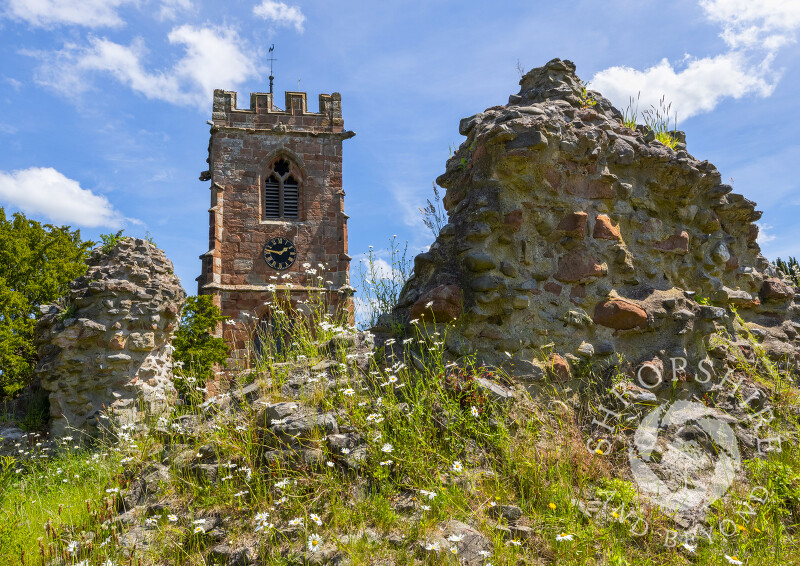The church of St John the Baptist, with the castle riuins at Ruyton XI Towns, north Shropshire.