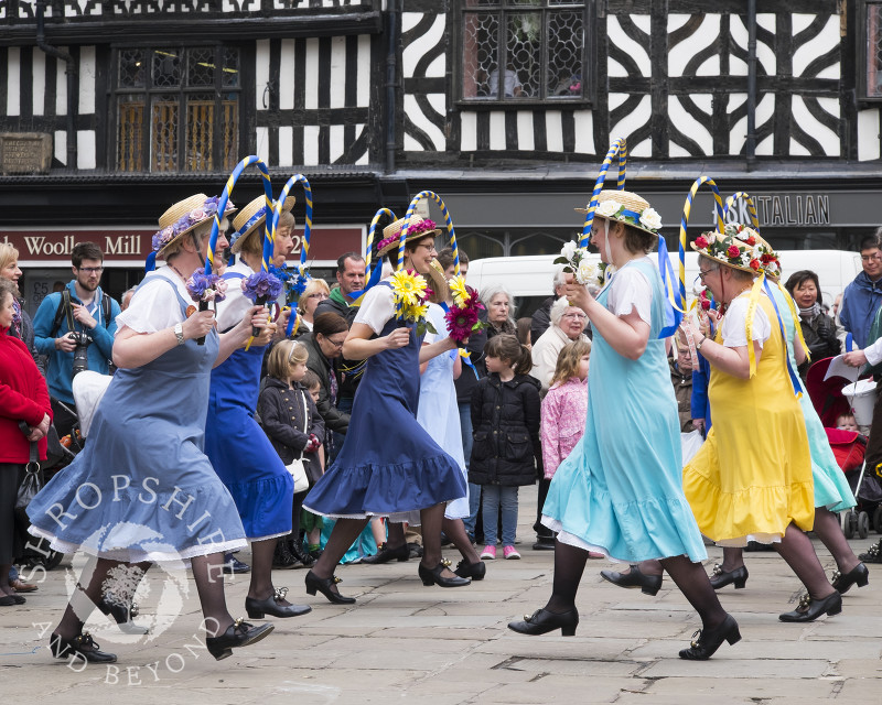 The Shrewsbury Lasses, part of Shrewsbury Morris, perform in the Square at the Big Busk, Shrewsbury, Shropshire, England.