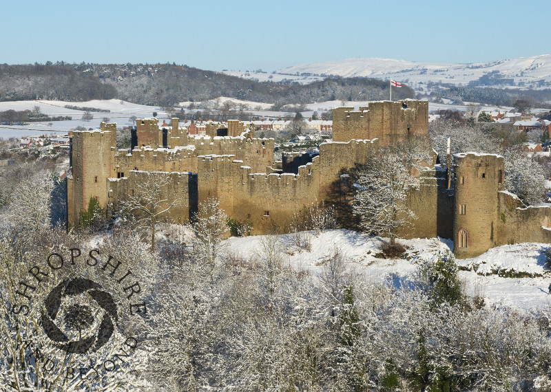 Ludlow Castle under a blanket of snow seen from Whitcliffe Common, Shropshire.