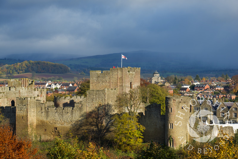 Ludlow castle in autumn, with an approaching shower over Brown Clee Hill, Shropshire, England.
