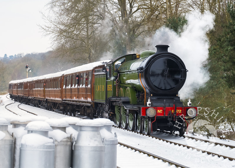 LNER steam locomotive 8572 pulling into Hampton Loade station on the Severn Valley Railway, Shropshire.