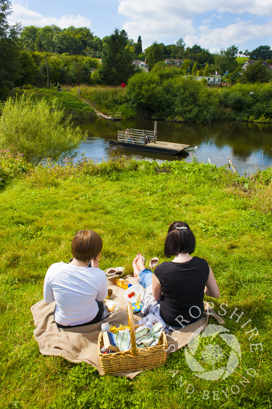 Picnic time overlooking Hampton Loade ferry across the River Severn, near Bridgnorth, Shropshire, England.