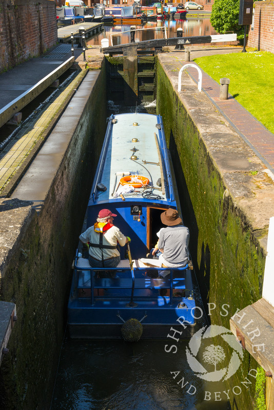 A narrowboat in a lock at the canal basin, Stourport-on-Severn, Worcestershire, England.