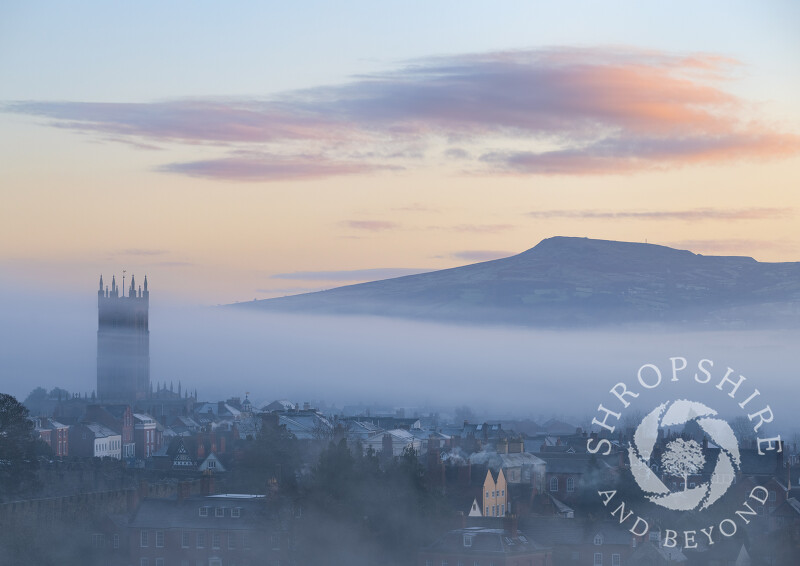 Dawn breaks over Ludlow with Titterstone Clee on the horizon, Shropshire.