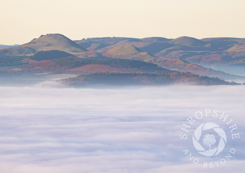The Stretton Hills rise above the clouds, seen from the Wrekin, Shropshire.