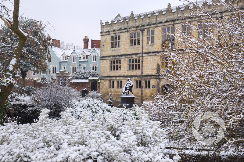 Winter snow on the Charles Darwin statue outside Shrewsbury library, Shropshire, England.