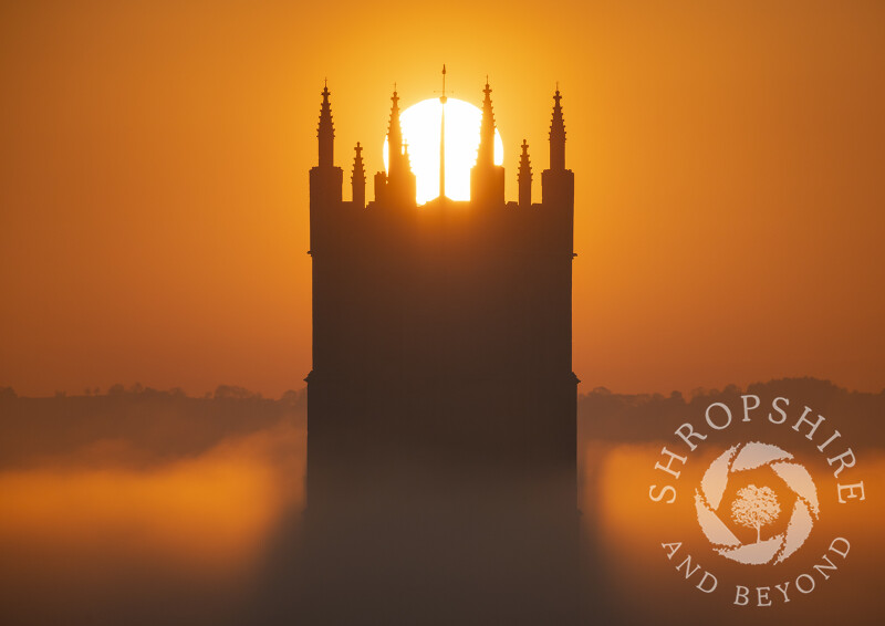 Sunrise over St Laurence's Church tower at Ludlow, Shropshire.