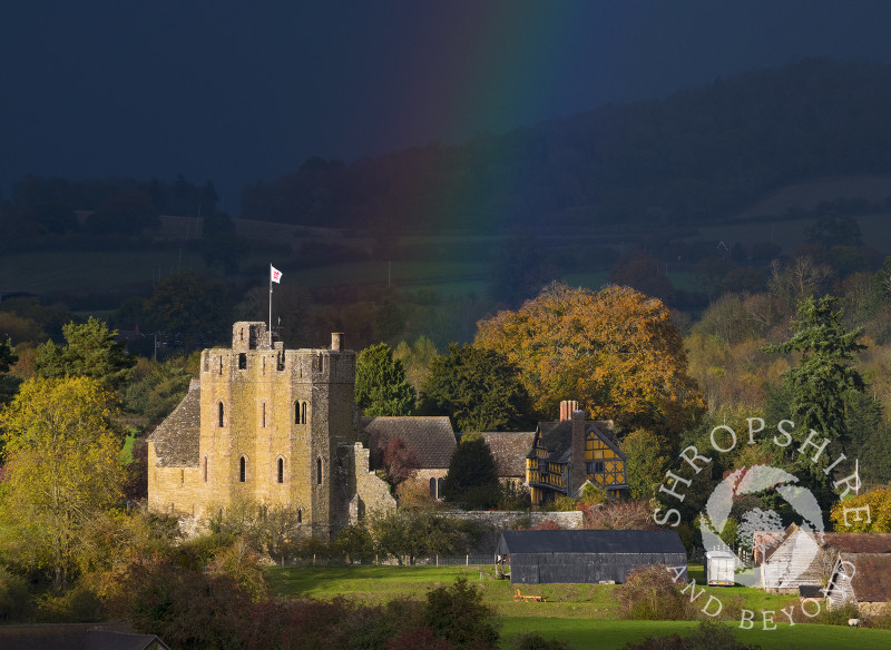 Autumn sunshine and rainbow at Stokesay Castle, Shropshire.