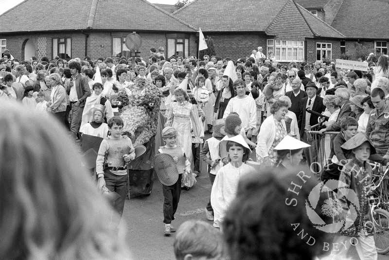 The parade heads into Curriers Lane during the annual carnival in Shifnal, Shropshire, in June 1987.