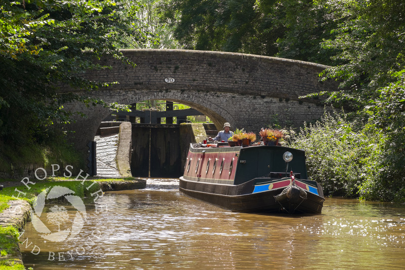 A narrowboat negotiates Adderley Locks on the Shropshire Union Canal, Shropshire.