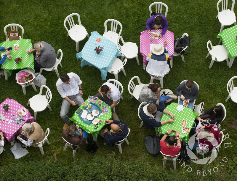 Visitors take a break in the castle grounds at the 2014 Ludlow Food Festival, Shropshire, England.