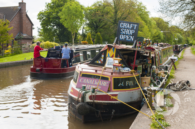 A craft shop on board a canal boat moored on the Shropshire Union Canal at Market Drayton, Shropshire, England.