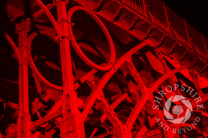 The Iron Bridge at Ironbridge, Shropshire, England. It was illuminated as part of the Night of Heritage Light, celebrating UNESCO world heritage sites.